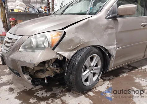 2009 Honda Odyssey Touring z USA, uszkodzony, nr VIN 5FNRL389X9B019298